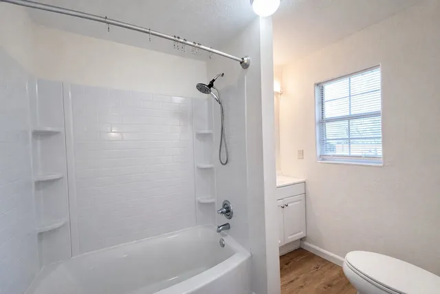 a bathroom with a bathtub and a shower
