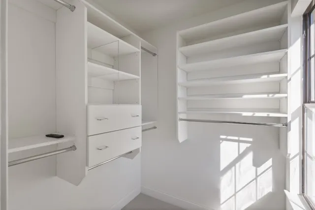 a bathroom with a shower and a toilet