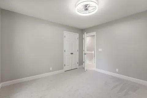 a view of an empty room and a window