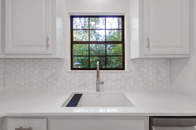 a bathroom with a bathtub and window
