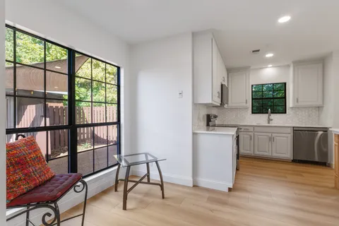 a kitchen with a stove a sink and a refrigerator