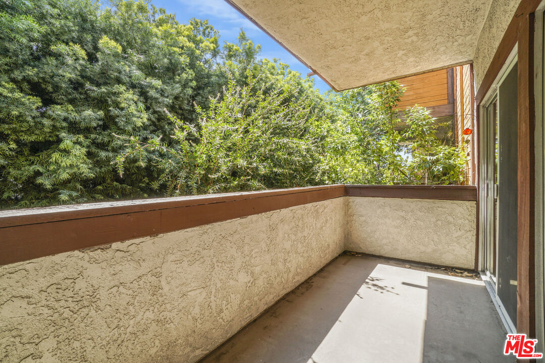 5534 Sylmar Avenue, Unit 5 Sherman Oaks, CA 91401 - Photo 13 of 33 a view of balcony with wooden floor