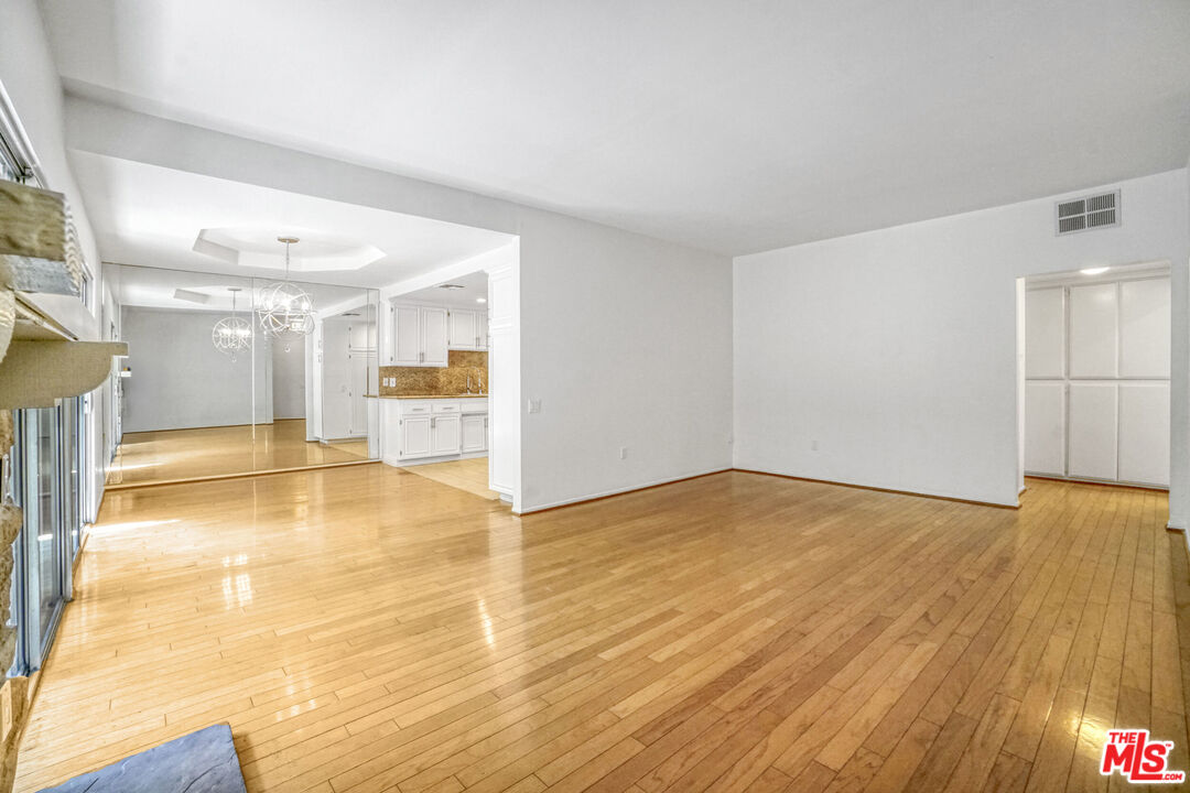5534 Sylmar Avenue, Unit 5 Sherman Oaks, CA 91401 - Photo 15 of 33 a view of an empty room with wooden floor