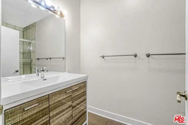 a bathroom with a shower toilet and sink