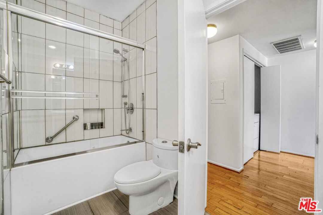 5534 Sylmar Avenue, Unit 5 Sherman Oaks, CA 91401 - Photo 18 of 33 a bathroom with a shower toilet and sink
