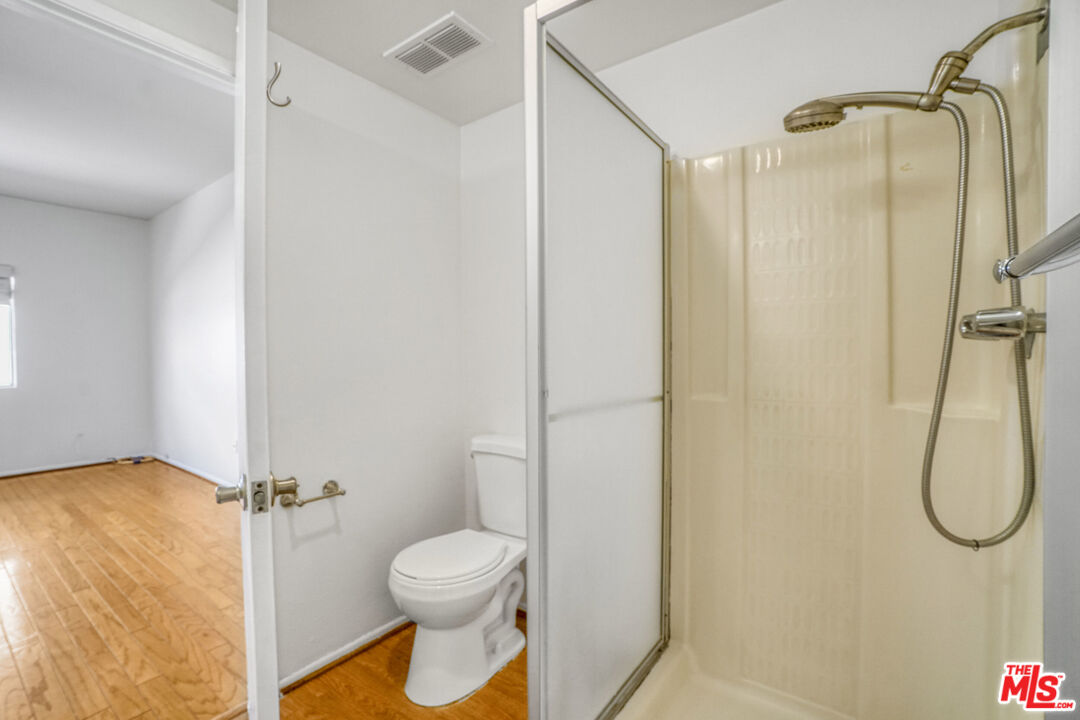 5534 Sylmar Avenue, Unit 5 Sherman Oaks, CA 91401 - Photo 24 of 33 a bathroom that has a shower toilet and sink