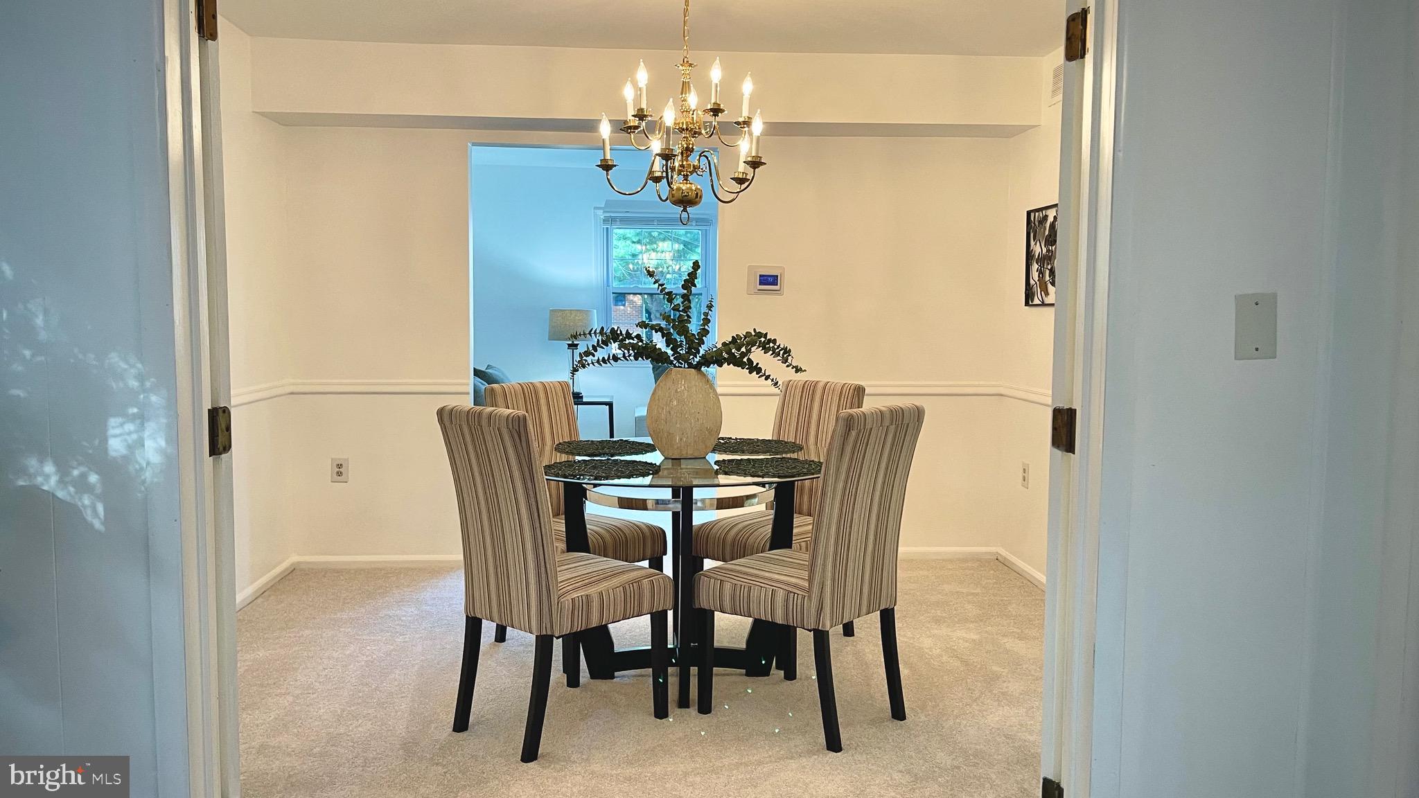 805 Devon Drive Newark, DE 19711 - Photo 16 of 35 a view of a dining room with furniture and chandelier