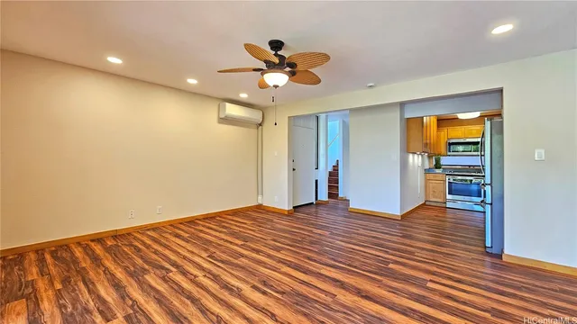 a kitchen with stainless steel appliances granite countertop a sink and a microwave