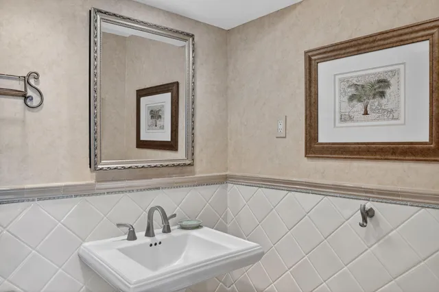 a bathroom with a sink and mirror