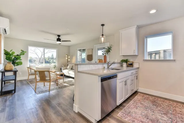 a kitchen with a sink stove and microwave