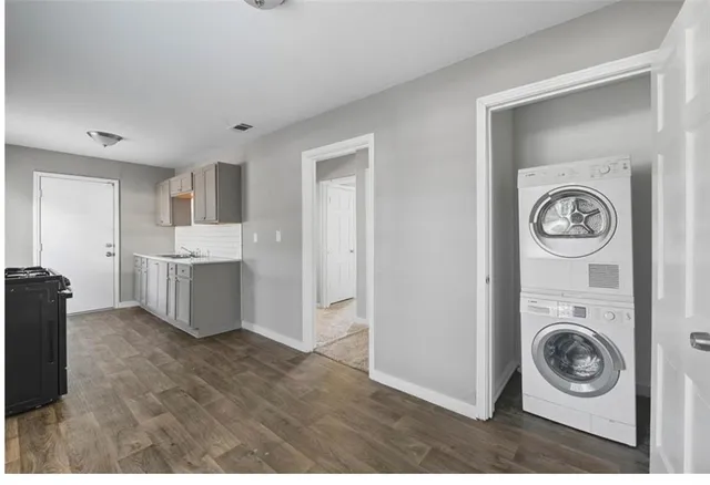 a view of a kitchen with washer and dryer