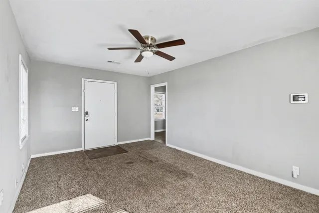 a view of a big room with wooden floor