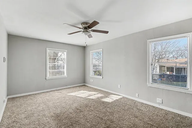 a view of empty room with windows