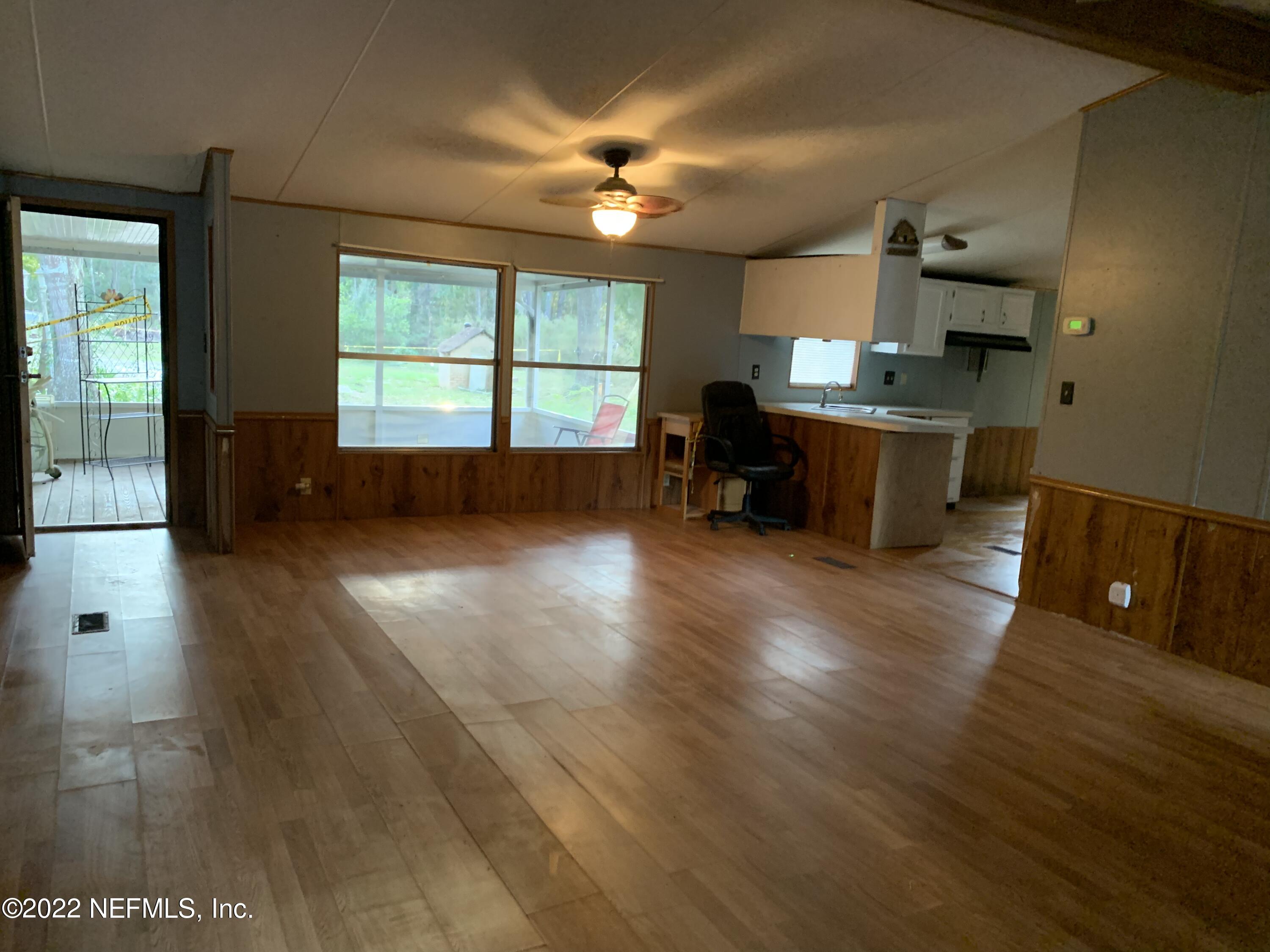 3163 Lannie Road Jacksonville, FL 32218 - Photo 13 of 36 a view of a kitchen with a sink and a window