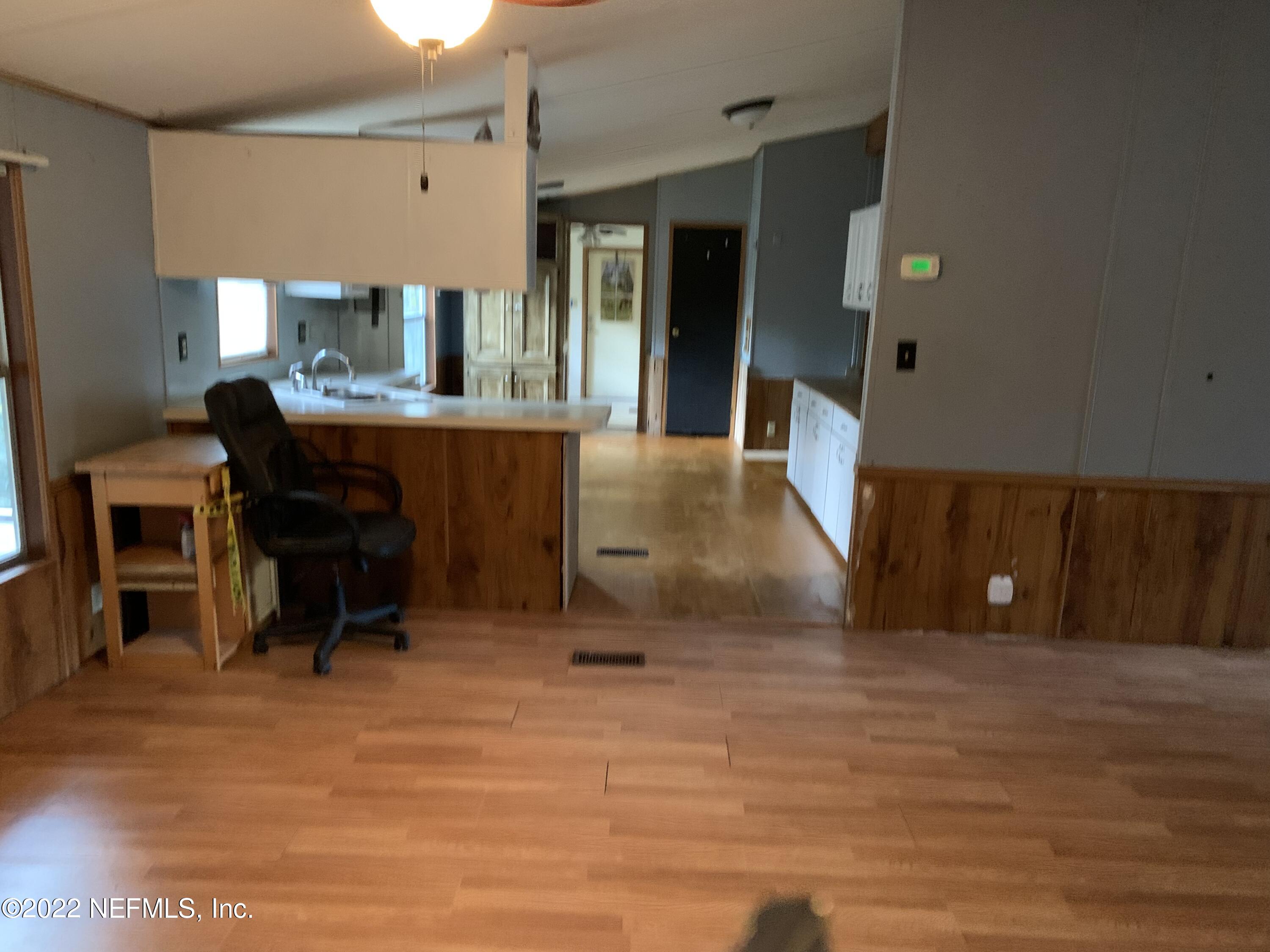 3163 Lannie Road Jacksonville, FL 32218 - Photo 16 of 36 a workspace with furniture and window