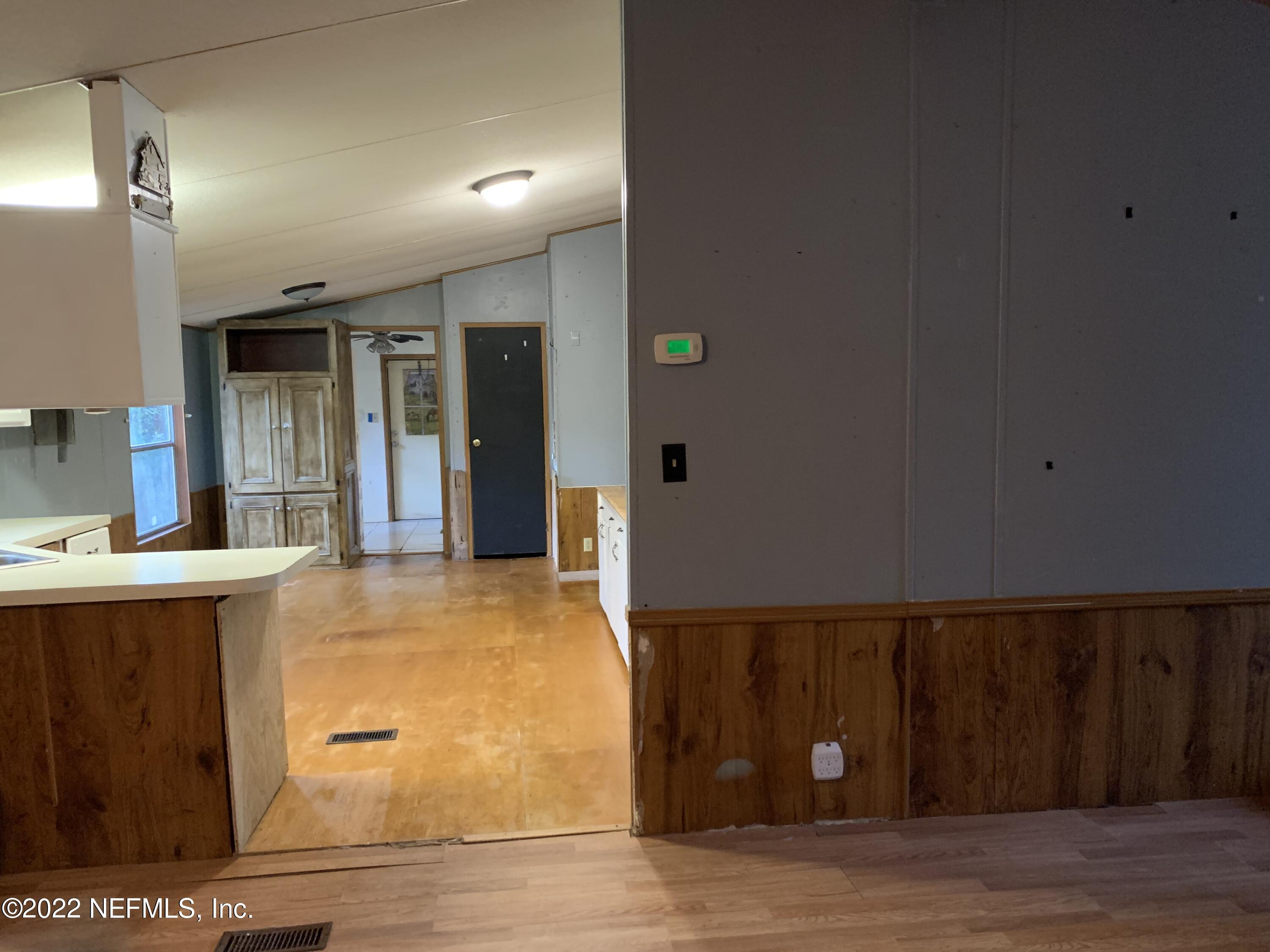 3163 Lannie Road Jacksonville, FL 32218 - Photo 18 of 36 a view of kitchen with wooden floor