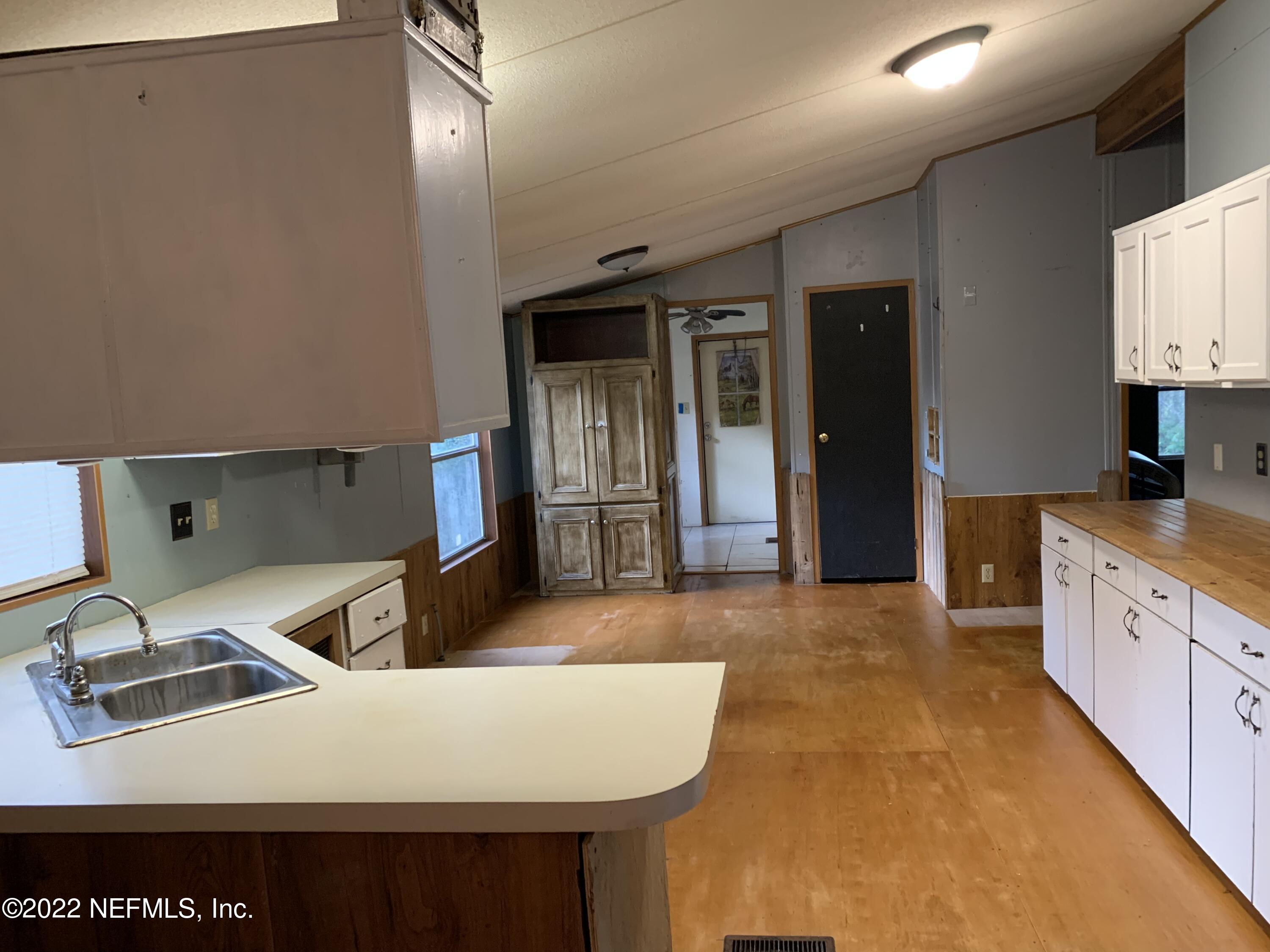 3163 Lannie Road Jacksonville, FL 32218 - Photo 20 of 36 a large white kitchen with sink