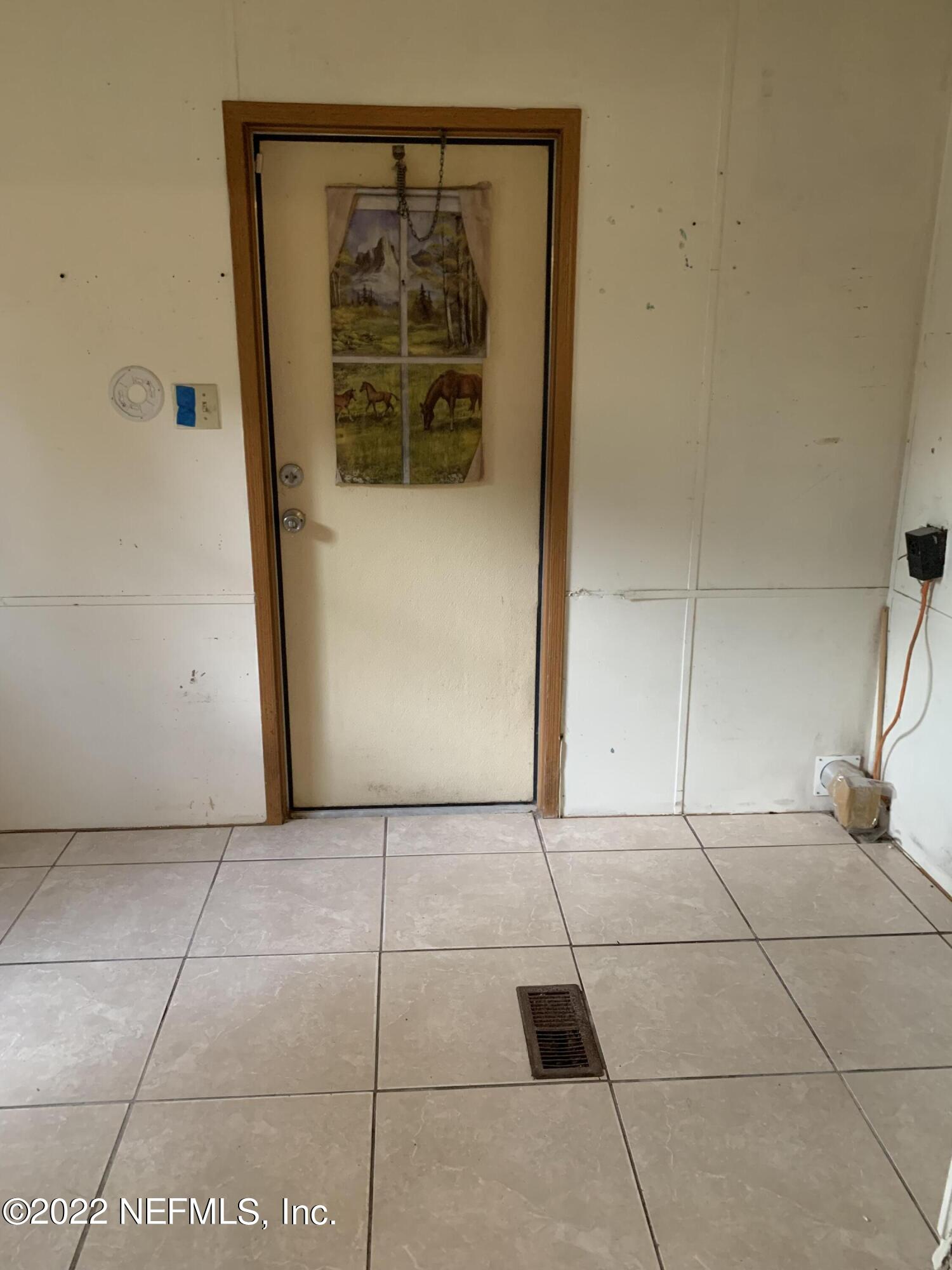 3163 Lannie Road Jacksonville, FL 32218 - Photo 22 of 36 a view of an empty room with a window