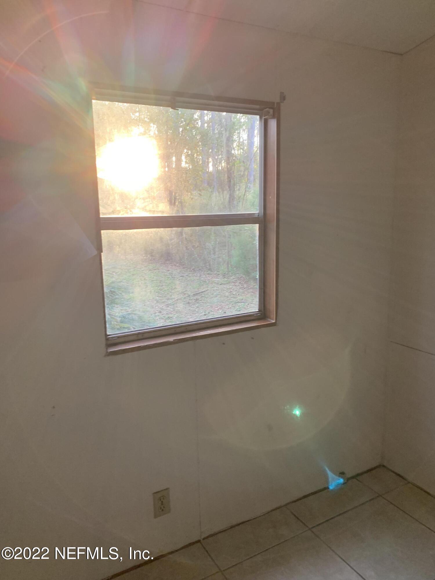 3163 Lannie Road Jacksonville, FL 32218 - Photo 23 of 36 an empty room with a window