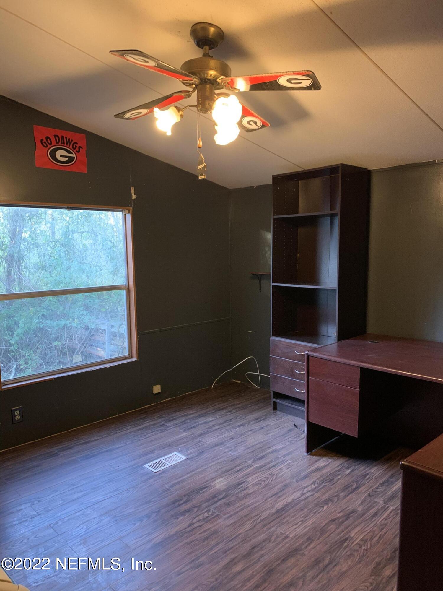 3163 Lannie Road Jacksonville, FL 32218 - Photo 26 of 36 a view of room with furniture and a flat screen tv