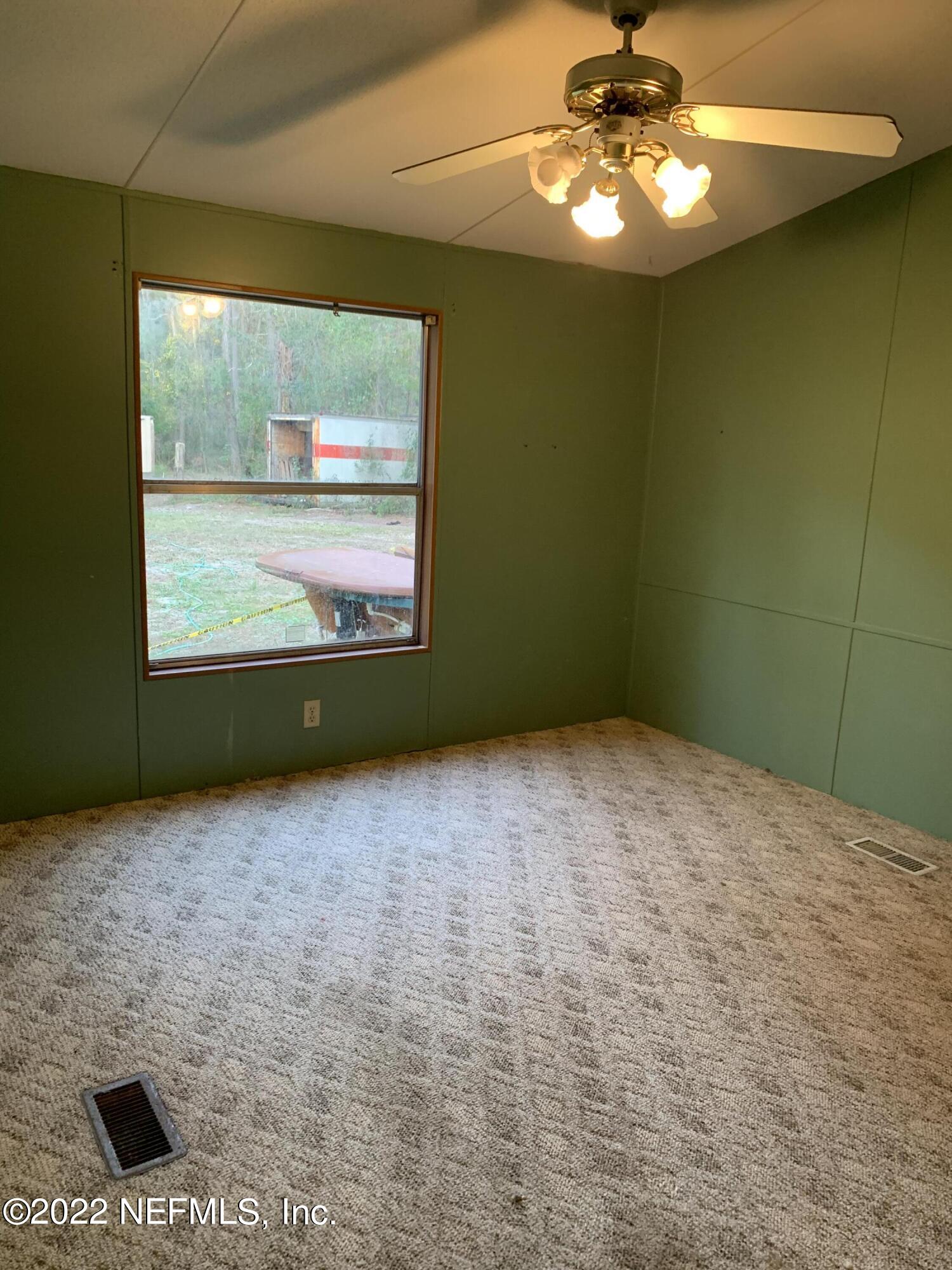 3163 Lannie Road Jacksonville, FL 32218 - Photo 27 of 36 a view of an empty room with a window