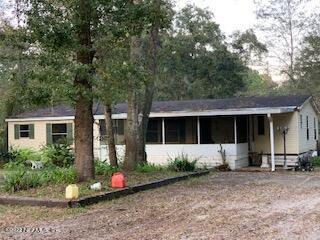 3163 Lannie Road Jacksonville, FL 32218 - Photo 8 of 36 a front view of a house with garden