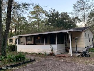 3163 Lannie Road Jacksonville, FL 32218 - Photo 9 of 36 front view of a house with a yard