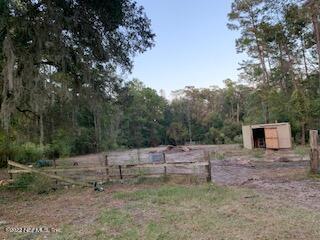 3163 Lannie Road Jacksonville, FL 32218 - Photo 10 of 36 a backyard of a house with oven and wooden fence