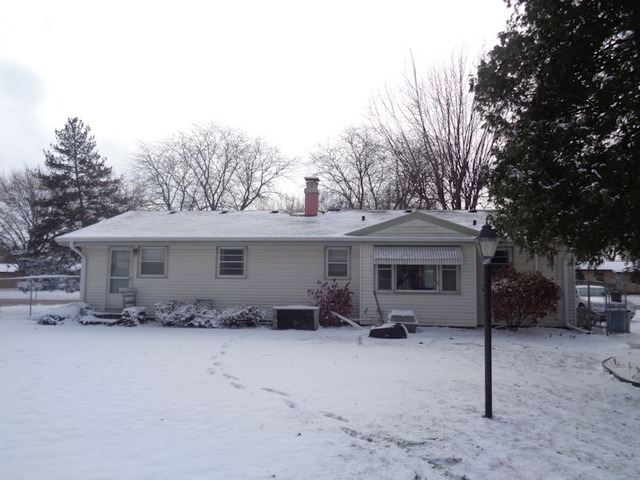 102 Cleveland Avenue Rochelle, IL 61068 - Photo 12 of 14 a view of a house with a snow in the yard