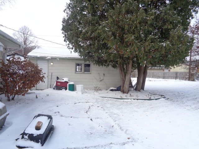 102 Cleveland Avenue Rochelle, IL 61068 - Photo 13 of 14 a view of a house with snow on the road
