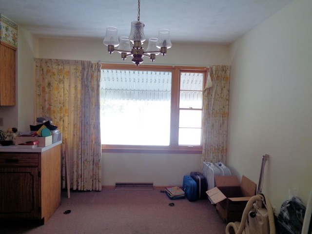 102 Cleveland Avenue Rochelle, IL 61068 - Photo 4 of 14 a room with furniture and a chandelier