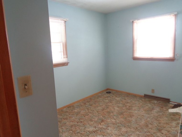 102 Cleveland Avenue Rochelle, IL 61068 - Photo 6 of 14 an empty room with a window