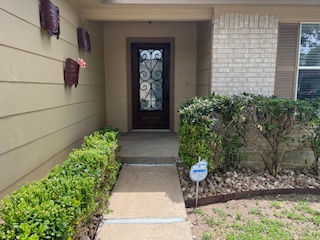 14909 Nuttall Drive Austin, TX 78724 - Photo 2 of 13 Property entrance featuring brick siding