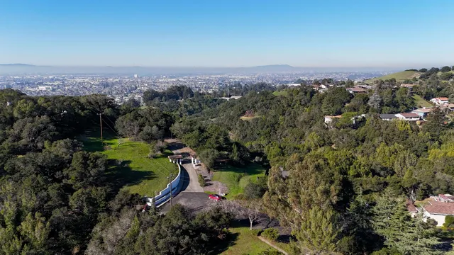 an aerial view of a house with a garden