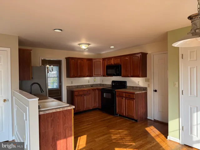 a bath tub sitting in a bathroom next to a window