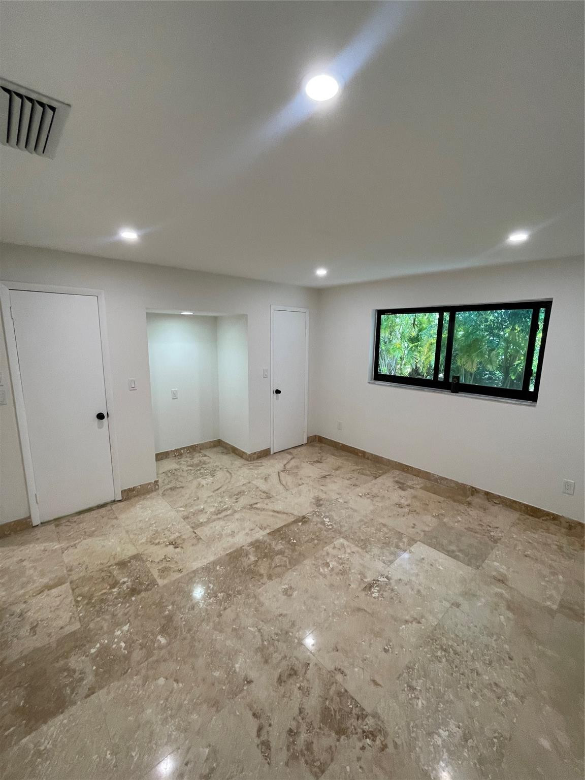 16881 Southwest 276th Street Homestead, FL 33031 - Photo 11 of 17 a view of an empty room with a window