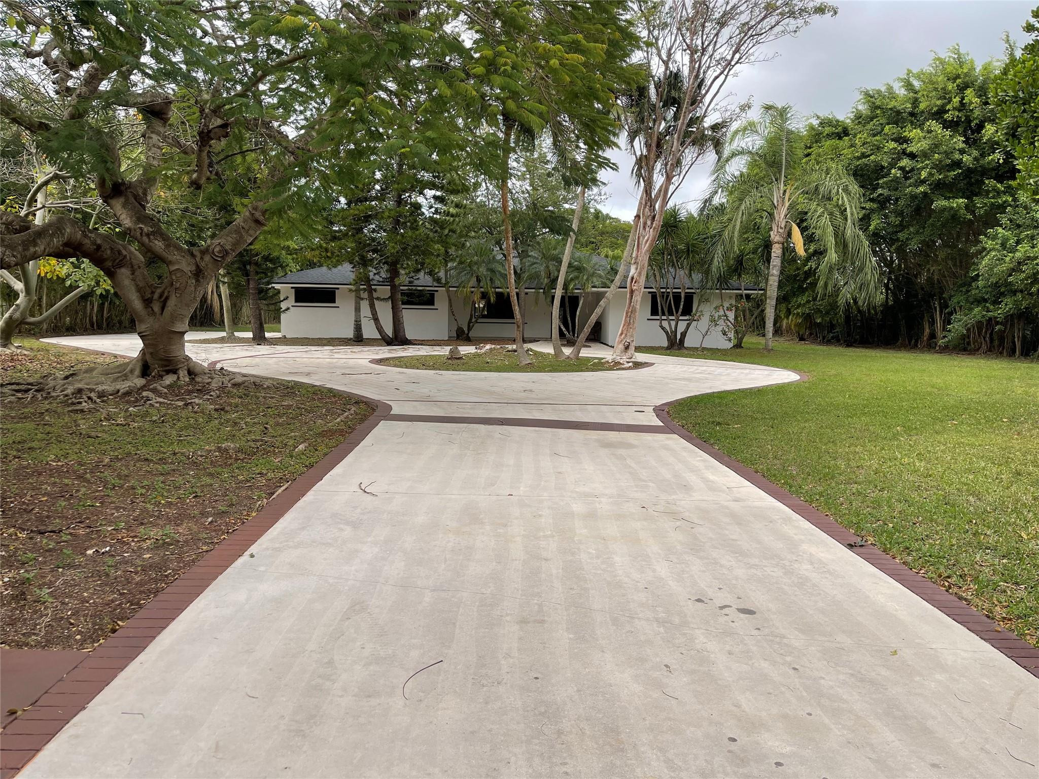 16881 Southwest 276th Street Homestead, FL 33031 - Photo 17 of 17 a view of a swimming pool with a patio