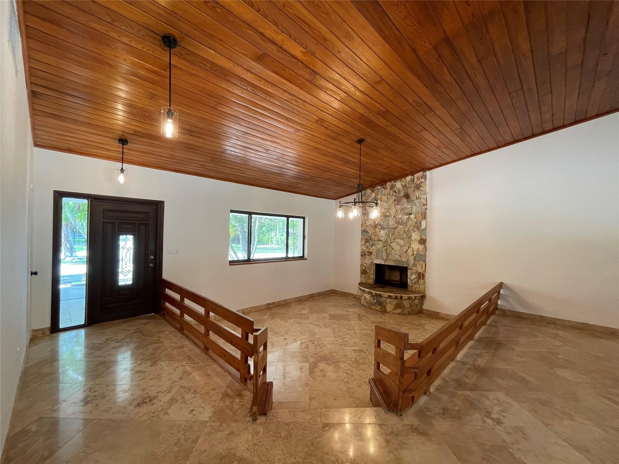 16881 Southwest 276th Street Homestead, FL 33031 - Photo 3 of 17 a view of a livingroom with a fireplace
