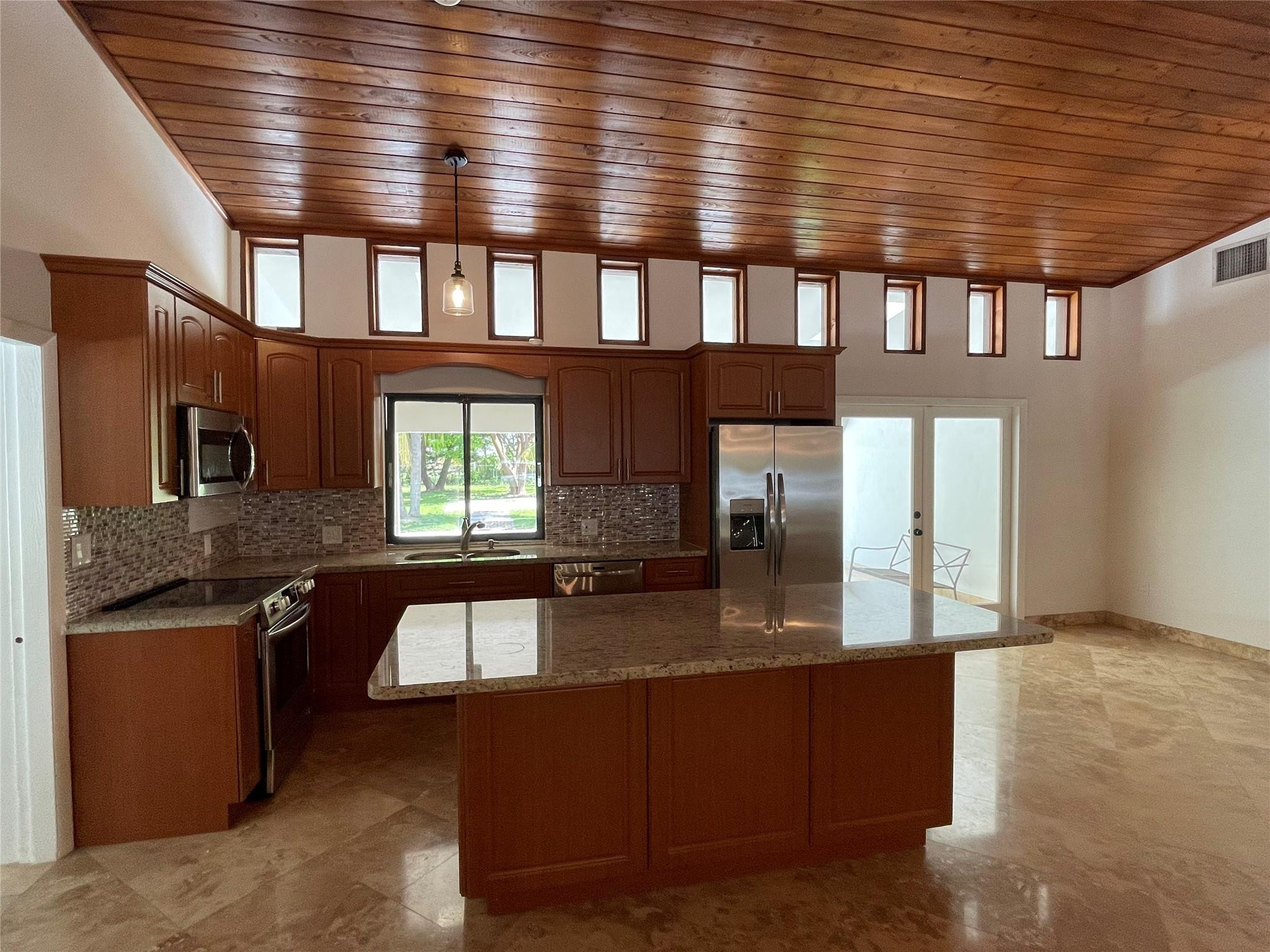 16881 Southwest 276th Street Homestead, FL 33031 - Photo 5 of 17 a kitchen with granite countertop lots of counter top space