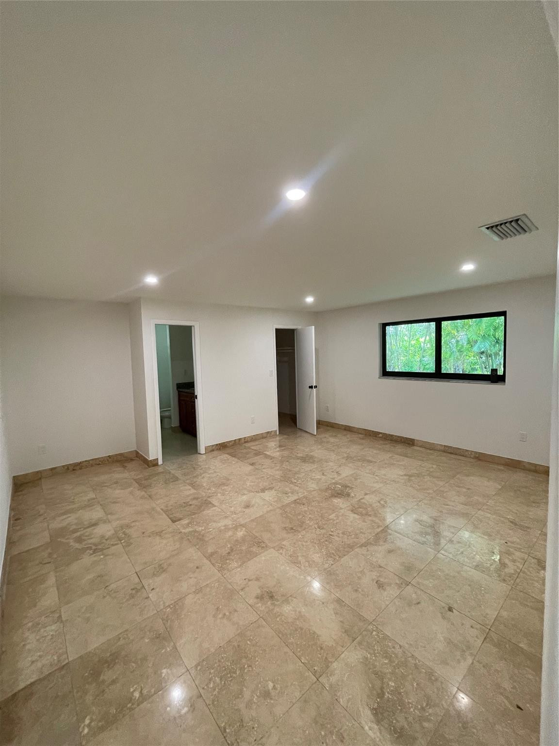 16881 Southwest 276th Street Homestead, FL 33031 - Photo 8 of 17 a view of an empty room with a window