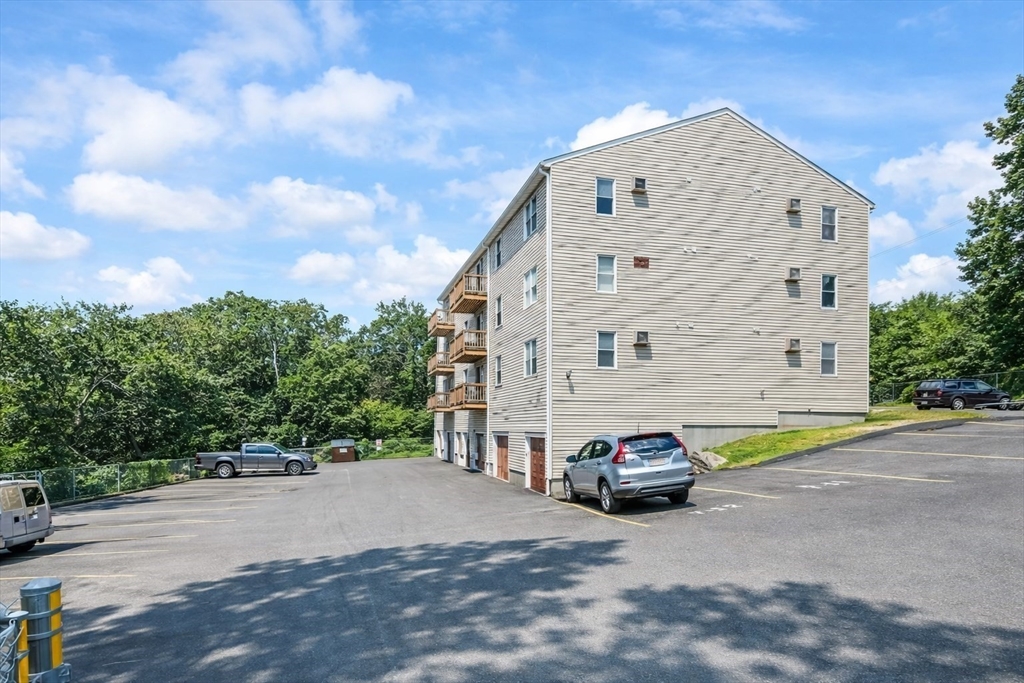 7 Gibbs Street, Unit 7 Worcester, MA 01607 - Photo 2 of 20 a car parked in front of a building