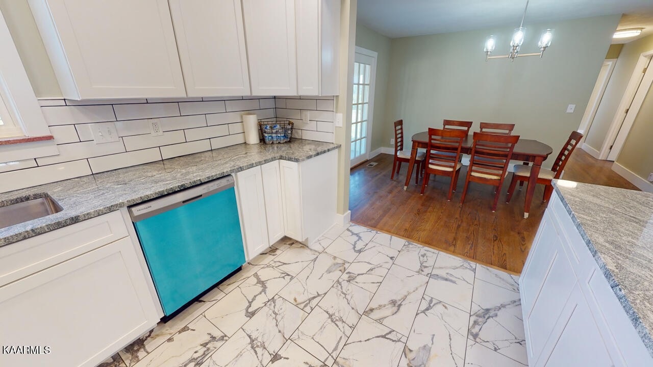 3877 Riverview Road Lenoir City, TN 37771 - Photo 15 of 47 a kitchen with sink and cabinets