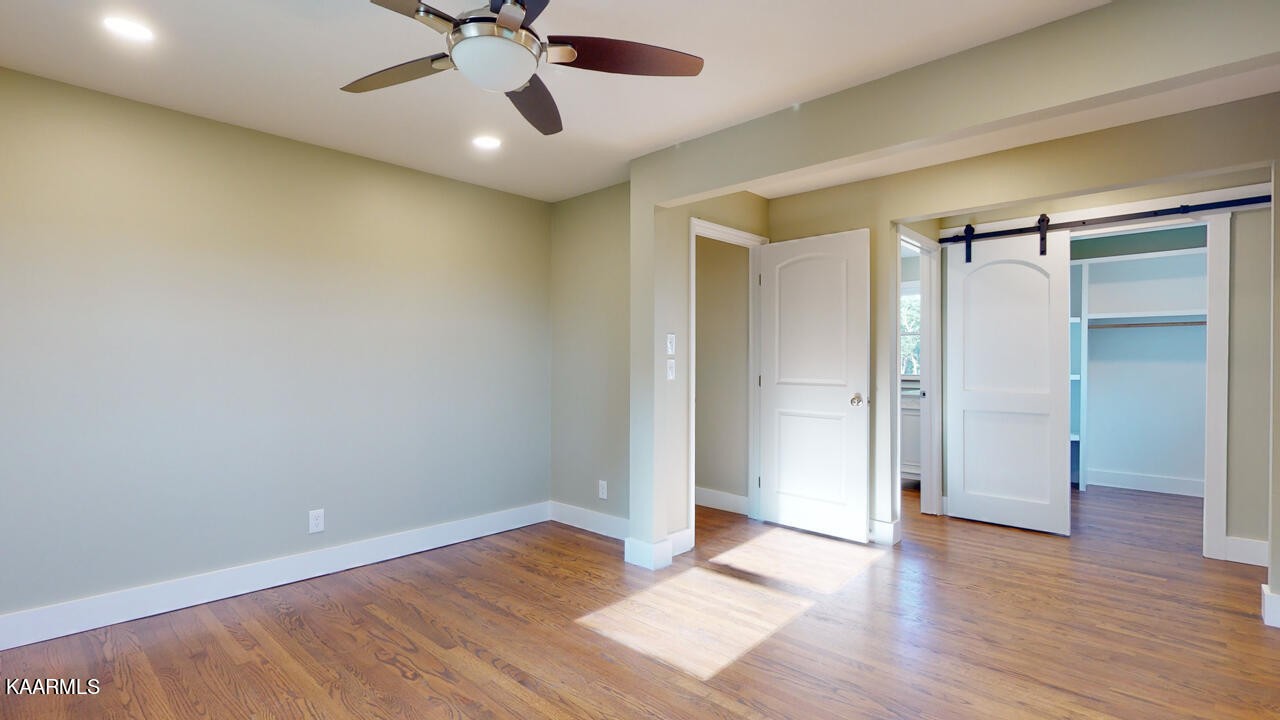 3877 Riverview Road Lenoir City, TN 37771 - Photo 20 of 47 wooden floor in an empty room