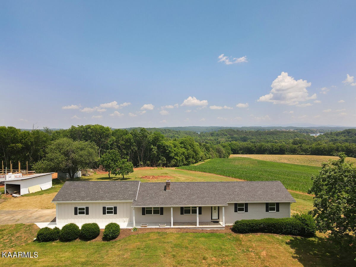 3877 Riverview Road Lenoir City, TN 37771 - Photo 2 of 47 a aerial view of a house next to a big yard