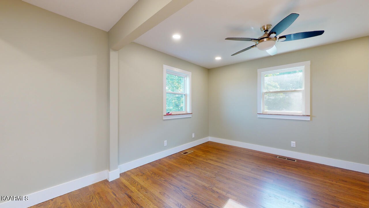 3877 Riverview Road Lenoir City, TN 37771 - Photo 21 of 47 a view of a room with wooden floor and natural light