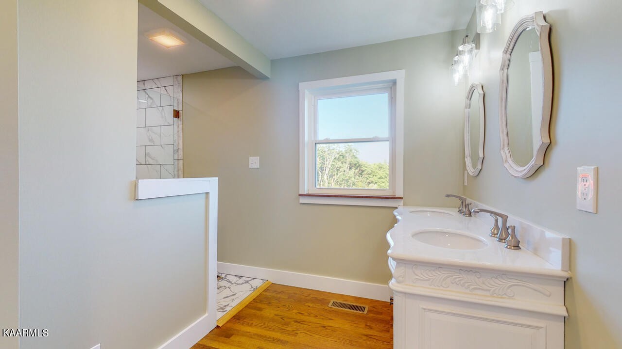 3877 Riverview Road Lenoir City, TN 37771 - Photo 22 of 47 a bathroom with a granite countertop sink and a mirror