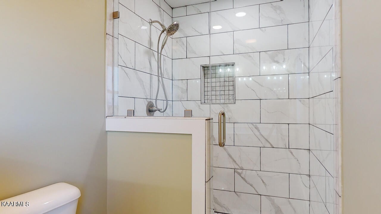 3877 Riverview Road Lenoir City, TN 37771 - Photo 24 of 47 a bathroom with a sink toilet and shower