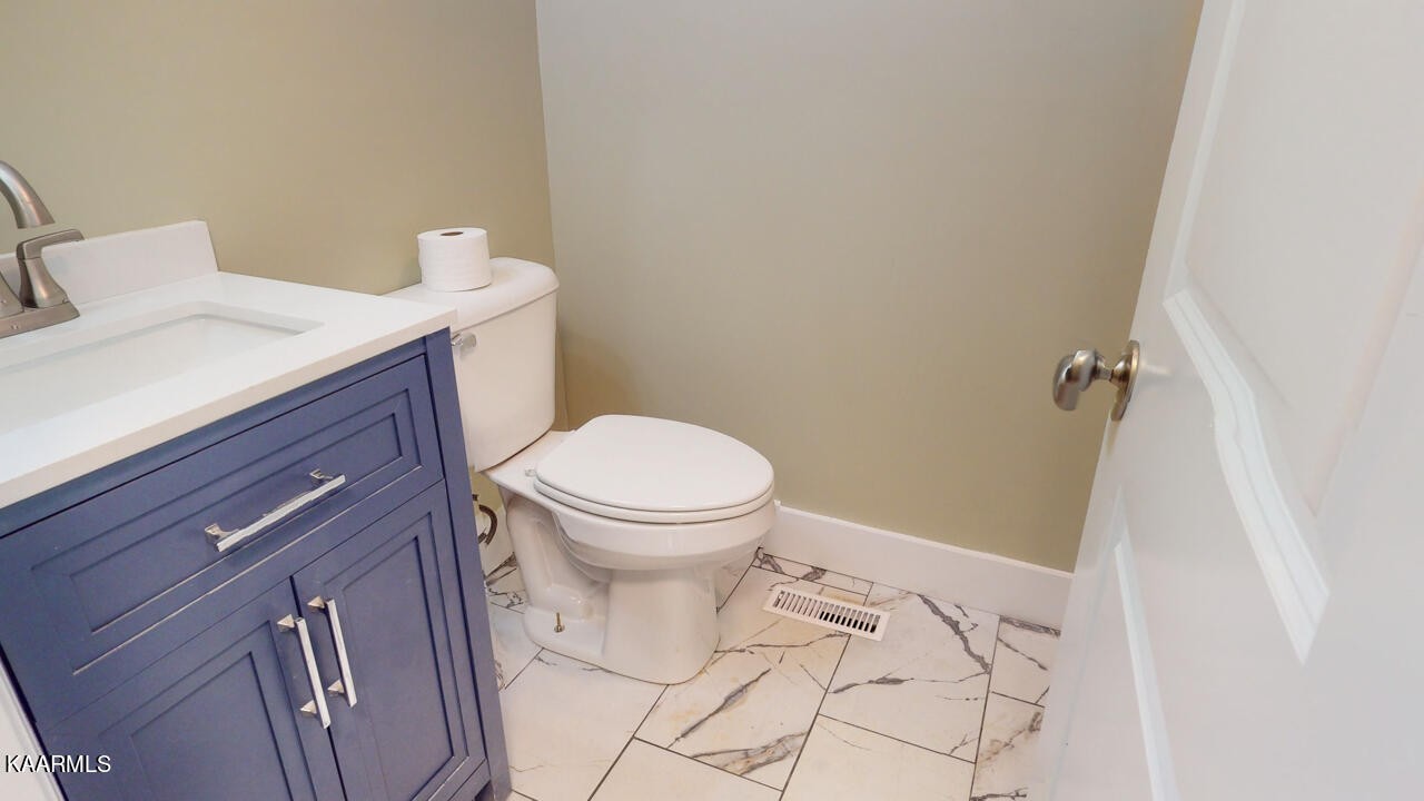 3877 Riverview Road Lenoir City, TN 37771 - Photo 28 of 47 a bathroom with a sink and a toilet
