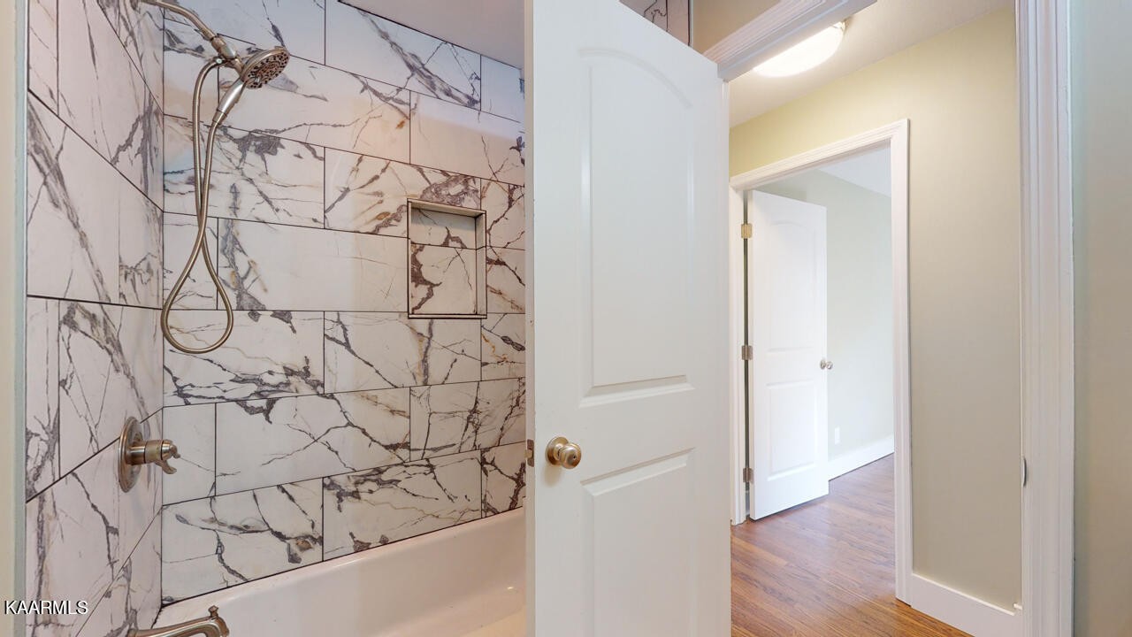 3877 Riverview Road Lenoir City, TN 37771 - Photo 29 of 47 a bathroom with a bathtub and shower