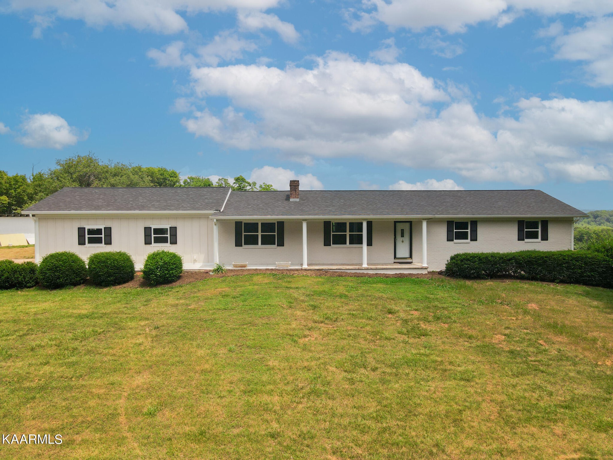 3877 Riverview Road Lenoir City, TN 37771 - Photo 3 of 47 a front view of a house with a yard